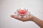 Root Chakra Candle in Hand