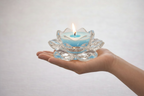 Throat Chakra Candle in Hand