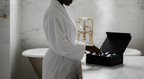 Wide side shot — full silhouette, bathtub behind